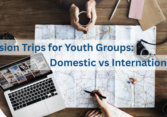 Cover image of blog post about mission trips for youth groups featuring two people planning a trip with a map, computer, and camera
