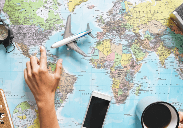 Cover photo of finger pointing at map for blog post about planning a pilgrimage