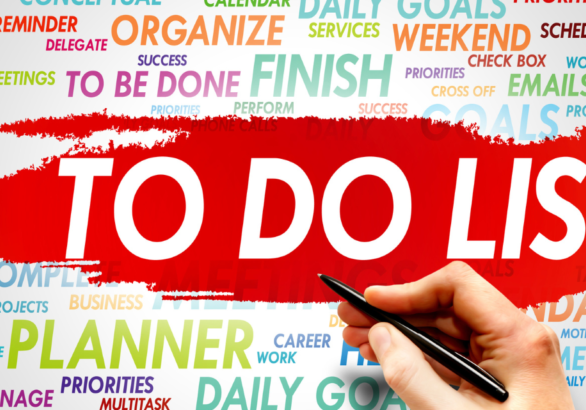 Image of hand with words to do list for complete mission trip planning guide