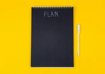 image of black notebook with the word PLAN