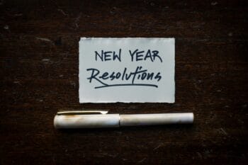 note that says new year resolution for blog post about planning a pilgrimage or mission trip with Wonder Voyage
