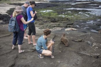 tourist taking picture in Galapagos Islands for blog post about transformative global travel